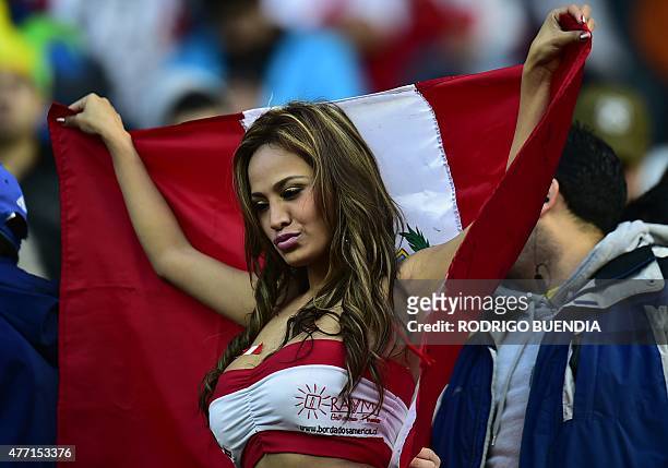 Supporter of Peru cheers for her team before the Copa America 2015 football match against Brazil on June 14, 2015 in Temuco, Chile. AFP PHOTO /...