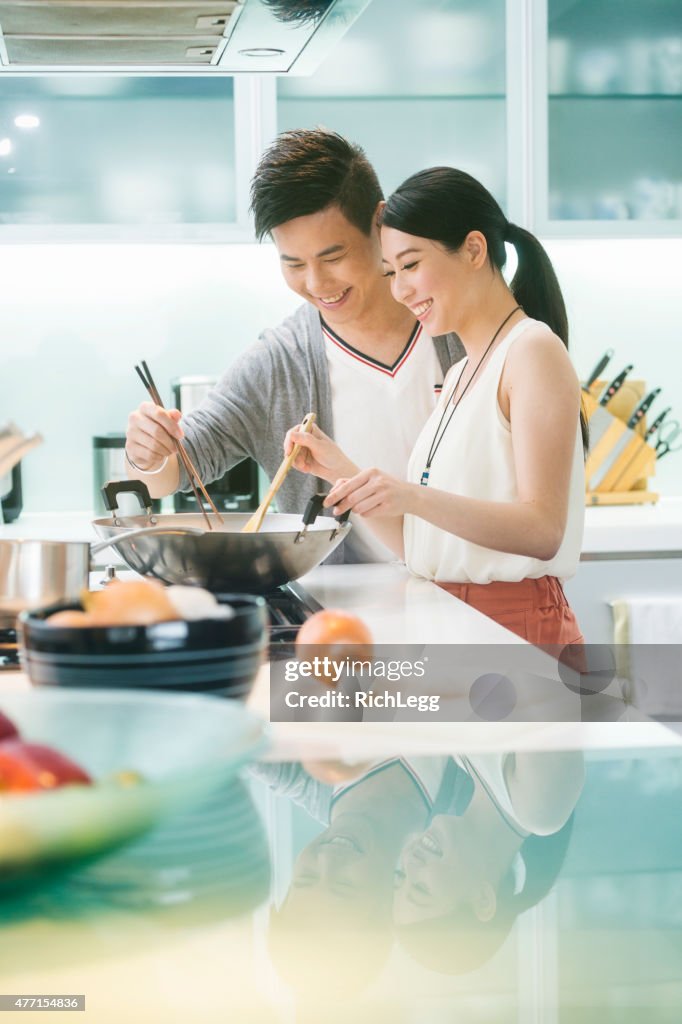 Young Chinese Couple in Kitchen