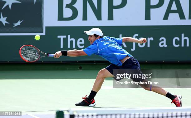 Daniel Munoz-De La Nava of Spain hits a return to Julien Benneteau of France during the BNP Paribas Open at Indian Wells Tennis Garden on March 7,...