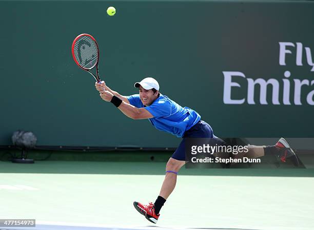 Daniel Munoz-De La Nava of Spain hits a return to Julien Benneteau of France during the BNP Paribas Open at Indian Wells Tennis Garden on March 7,...