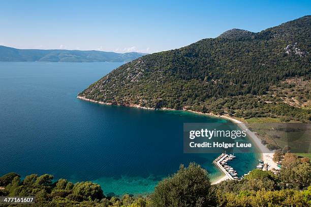 fishing boats at pier, beach and coastline - ithaca stock pictures, royalty-free photos & images