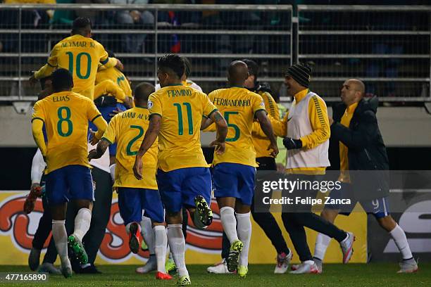 Douglas Costa of Brazil celebrates with teammates after scoring the second goal of his team during the 2015 Copa America Chile Group C match between...