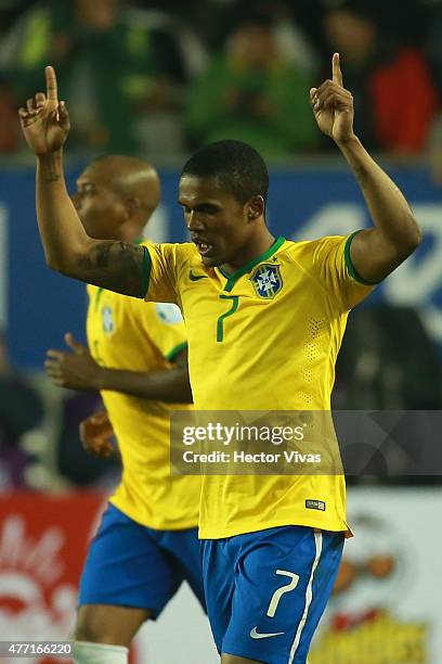 Douglas Costa of Brazil celebrates after scoring the second goal of his team during the 2015 Copa America Chile Group C match between Brazil and Peru...