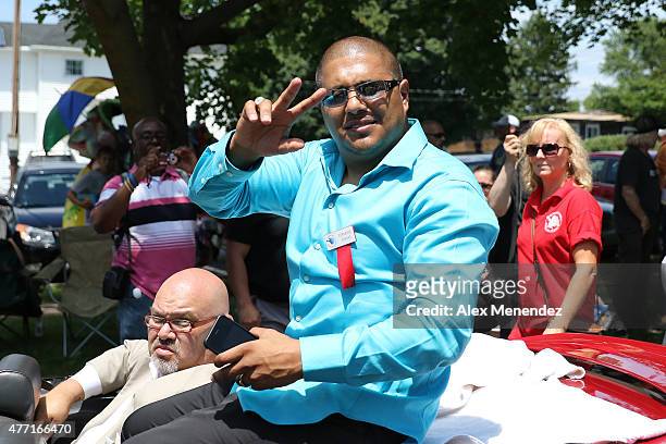 Boxer Fernando Vargas poses while riding in a car during the parade at the International Boxing Hall of Fame induction Weekend of Champions events on...