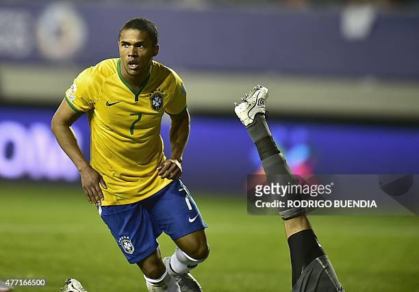 Brazil's midfielder Douglas Costa celebates after scoring against Peru during their 2015 Copa America football championship match in Temuco, Chile,...