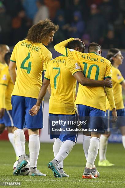 Felipe Luiz, Douglas Costa and Neymar of Brazil leave the field after the 2015 Copa America Chile Group C match between Brazil and Peru at Municipal...