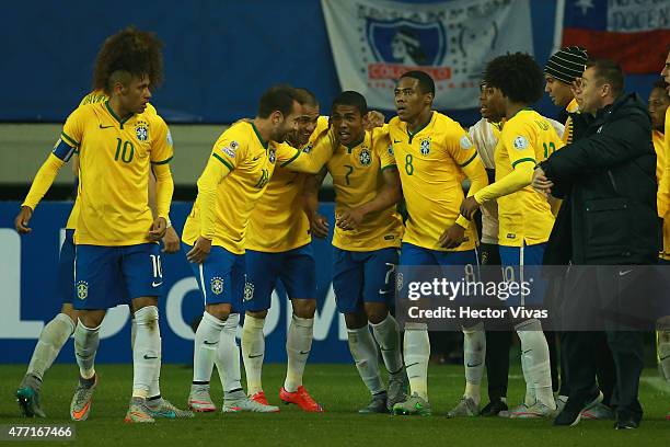 Douglas Costa of Brazil celebrates with teammates after scoring the second goal of his team during the 2015 Copa America Chile Group C match between...