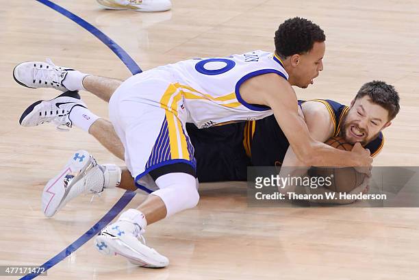 Stephen Curry of the Golden State Warriors and Matthew Dellavedova of the Cleveland Cavaliers vie for posession in the first quarter during Game Five...