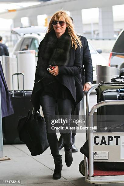 Heidi Klum arrives at JFK Airport on March 7, 2014 in New York City.
