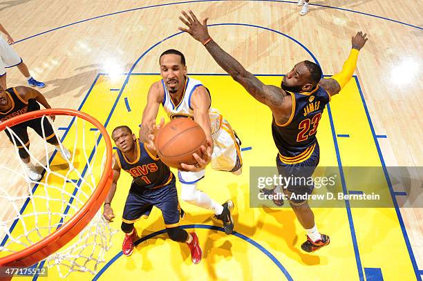 Shaun Livingston of the Golden State Warriors shoots against LeBron James of the Cleveland Cavaliers during Game Five of the 2015 NBA Finals at...