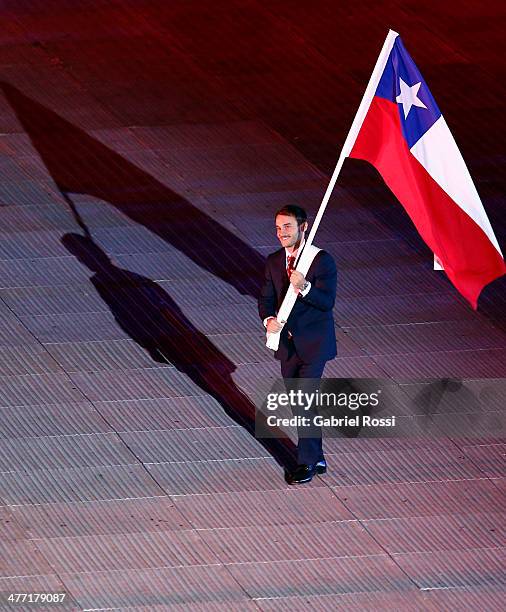 Chilean flag bearer Tomas Gonzalez enters the arena during the Opening Ceremony of the X South American Games Santiago 2014 at Estadio Nacional on...