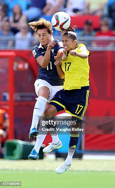 Gaetane Thiney of France and Carolina Arias of Colombia go up for a header during the FIFA Women's World Cup Group F match between France and...