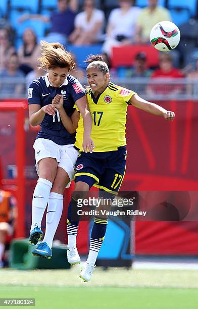Gaetane Thiney of France and Carolina Arias of Colombia go up for a header during the FIFA Women's World Cup Group F match between France and...