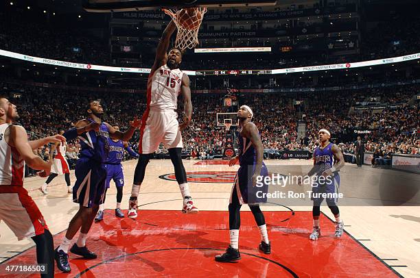March 7: Amir Johnson of the Toronto Raptors dunks against the Sacramento Kings on March 7, 2014 at the Air Canada Centre in Toronto, Ontario,...