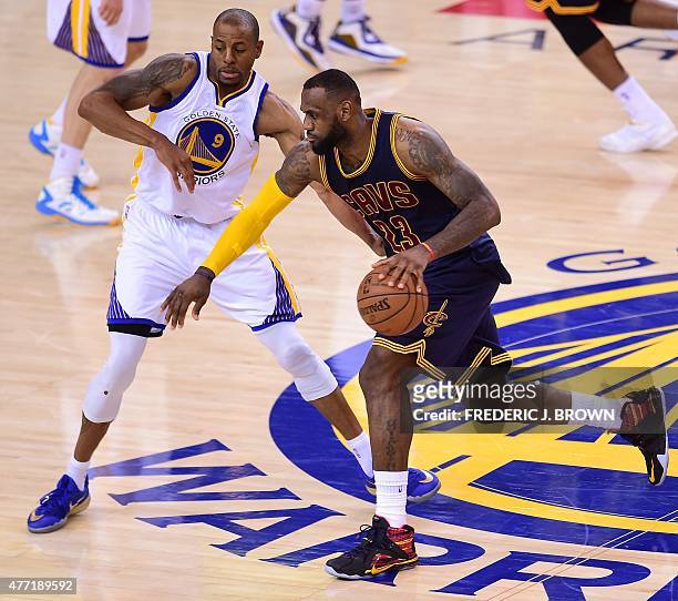 Andre Iguodala of the Golden State Warriors defends against Lebron James of the Cleveland Cavaliers during Game 5 of the 2015 NBA Finals on June 14,...
