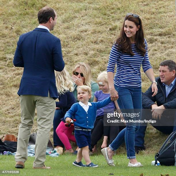 Andrew Tucker, Catherine, Duchess of Cambridge and Prince George of Cambridge attend the Gigaset Charity Polo Match at the Beaufort Polo Club on June...