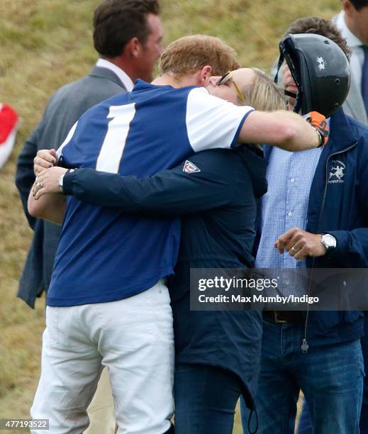 Prince Harry greets Zara Phillips as they attend the Gigaset Charity Polo Match at the Beaufort Polo Club on June 14, 2015 in Tetbury, England.