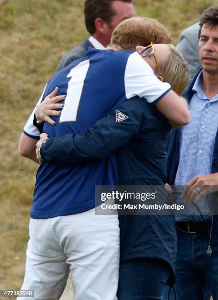 Prince Harry greets Zara Phillips as they attend the Gigaset Charity Polo Match at the Beaufort Polo Club on June 14, 2015 in Tetbury, England.