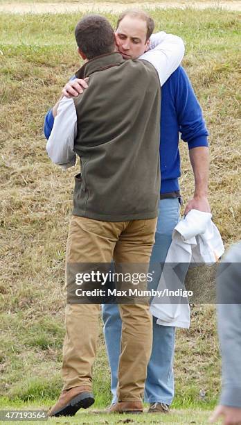 Peter Phillips greets Prince William, Duke of Cambridge as they attend the Gigaset Charity Polo Match at the Beaufort Polo Club on June 14, 2015 in...