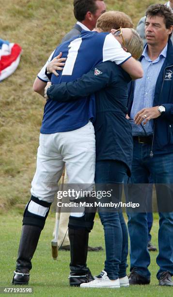 Prince Harry greets Zara Phillips as they attend the Gigaset Charity Polo Match at the Beaufort Polo Club on June 14, 2015 in Tetbury, England.