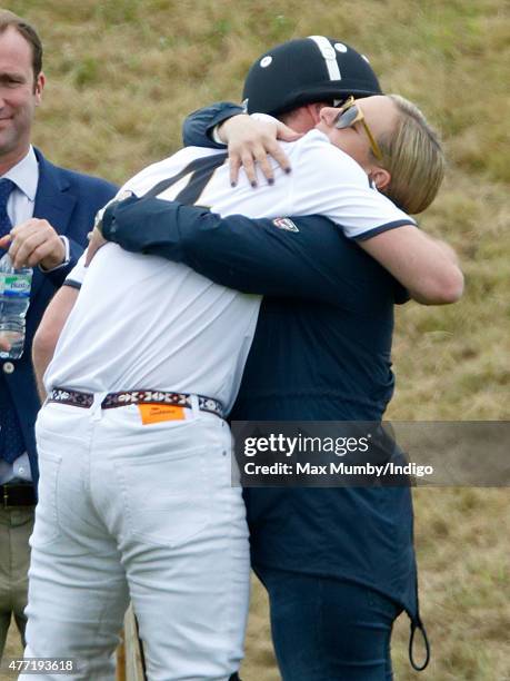 Prince William, Duke of Cambridge greets Zara Phillips as they attend the Gigaset Charity Polo Match at the Beaufort Polo Club on June 14, 2015 in...