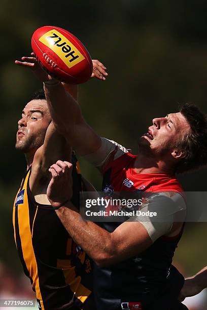 Jordan Lewis of the Hawks and Jack Fitzpatick of the Demons contest for the ball during the AFL practice match between the Melbourne Demons and the...