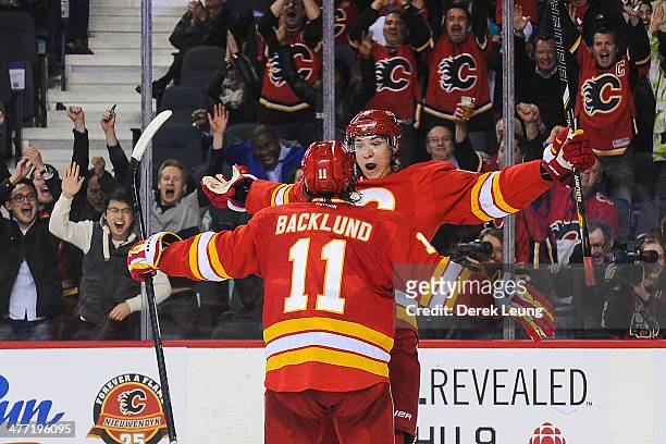 Joe Colborne of the Calgary Flames celebrates after scoring the game winning goal against the New York Islanders during an NHL game at Scotiabank...