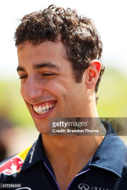 New hot lap record holder, Daniel Ricciardo of Infiniti Red Bull Racing shares a joke with a team member at the 2014 Top Gear Festival Sydney at...