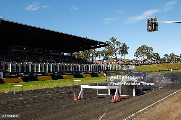 Top Gear presenter, Jeremy Clarkson driving a Dakar Truck races Australian hurdler, Michelle Jenneke at the 2014 Top Gear Festival Sydney at Sydney...