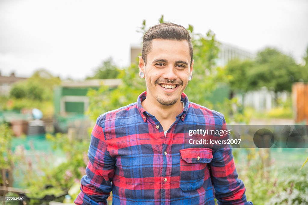 Smiling gardener at his allotment.