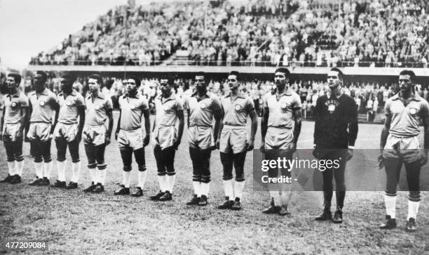 Brazilian national soccer team players are lined up during the national anthems before the start of their World Cup first round match against the...