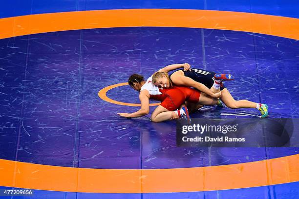 Burcu Orskaya Ugduler of Turkey and Aline Focken of Germany compete in the Women's wrestling 69kg Freestyle 1/8 Final match during day three of the...