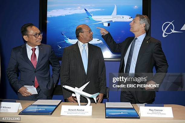 Garuda Indonesia President and CEO Arif Wibowo stands with Boeing Commercial Airplanes Senior Vice President Sales Asia Pacific and India Dinesh...