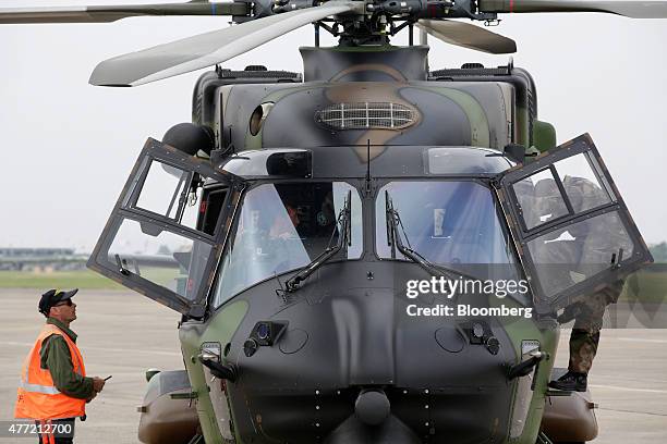 Flight crew prepare an NHIndustries NH90 Caiman helicopter for a demonstration flight on the opening day of the 51st International Paris Air Show in...