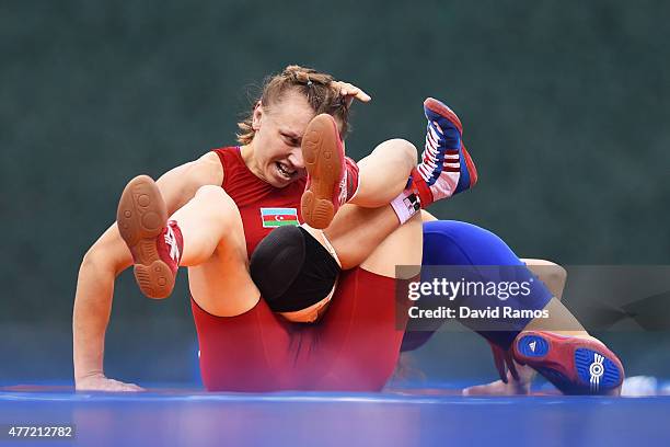 Yuliya Ratkevich of Azerbaijan and Taybe Yusein of Bulgaria compete in the Women's wrestling 60kg Freestyle 1/8 final match during day three of the...