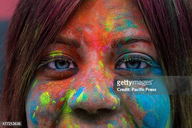 Thousands of people at the second edition of the Turin Holi Fusion, the Festival of Colors of Indian origin. In photo a beautiful color girl.
