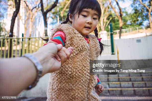 toddler girl leading her dad to the stair steps - 手を引く ストックフォトと画像