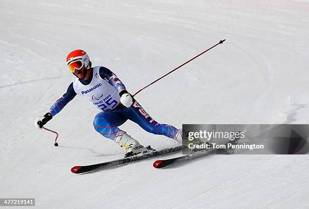 Mark Bathum of United States competes in the Men's Downhill - Visually Impaired during day one of Sochi 2014 Paralympic Winter Games at Rosa Khutor...