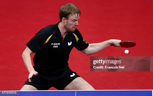 Patrick Baum of Germany competes in the Men's Team Table Tennis bronze medal match against Daniel Habesohn of Austria during day three of the Baku...