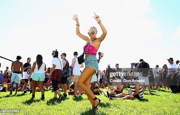 Girl is seen dancing amongst the crowd during the 2014 Future Music Festival at Royal Randwick Racecourse on March 8, 2014 in Sydney, Australia.