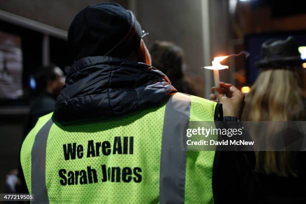 People gather at the International Cinematographers Guild national offices during a candlelight walk and memorial for Sarah Jones, an assistant...