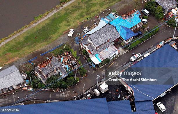 In this aerial image, roofs of houses are blown off by a strong winds on June 15, 2015 in Isesaki, Gunma, Japan. The blustery winds overturned cars...