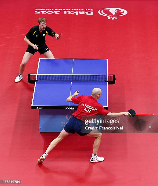 Patrick Baum of Germany and Daniel Habesohn of Austria compete in the Men's Team Table Tennis bronze medal match during day three of the Baku 2015...