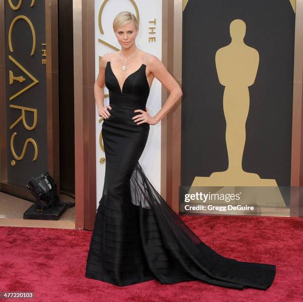 Actress Charlize Theron arrives at the 86th Annual Academy Awards at Hollywood & Highland Center on March 2, 2014 in Hollywood, California.