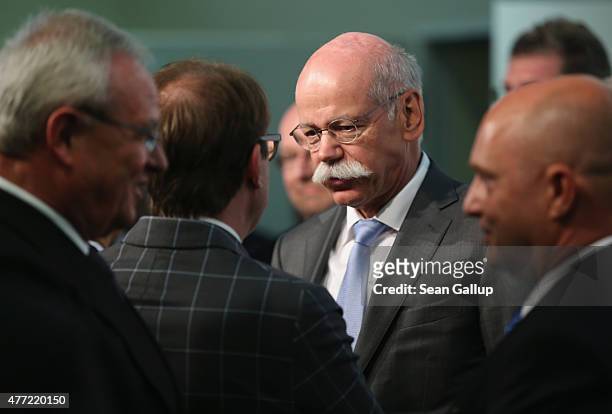 Daimler AG CEO Dieter Zetsche chats with German Transport Minister Alexander Dobrindt as Volkswagen Group CEO Martin Winterkorn arrives at the...