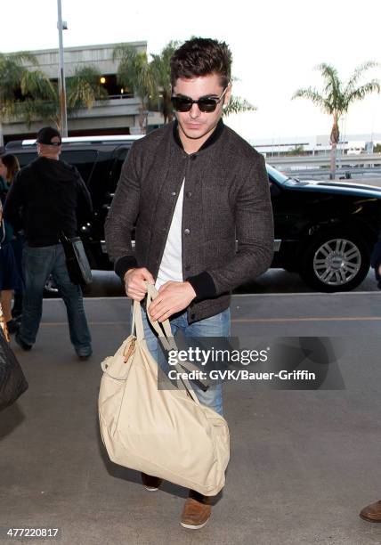 Zac Efron is seen at LAX on March 07, 2014 in Los Angeles, California.