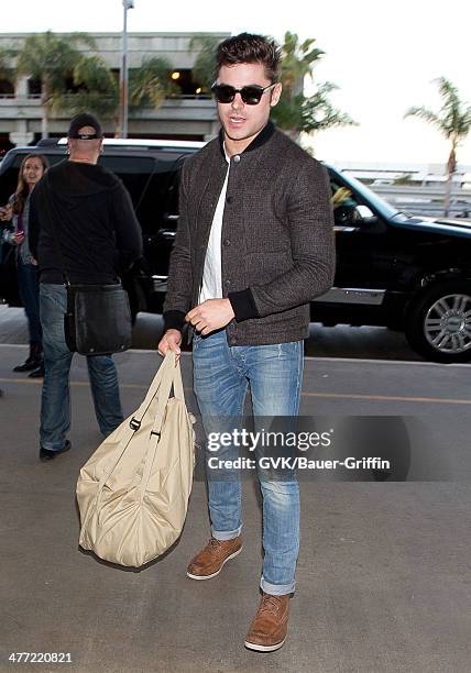 Zac Efron is seen at LAX on March 07, 2014 in Los Angeles, California.