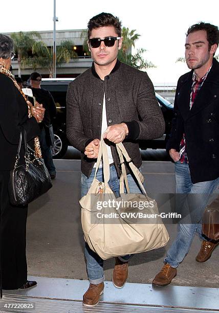 Zac Efron is seen at LAX on March 07, 2014 in Los Angeles, California.