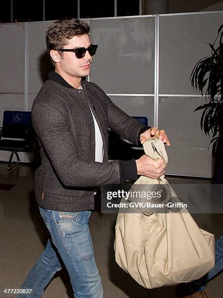 Zac Efron is seen at LAX on March 07, 2014 in Los Angeles, California.