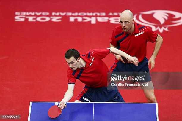 Stefan Fegerl and Daniel Habesohn of Austria compete in the Men's Team Table Tennis bronze medal match against Patrick Baum and Dimitrij Ovtcharov of...